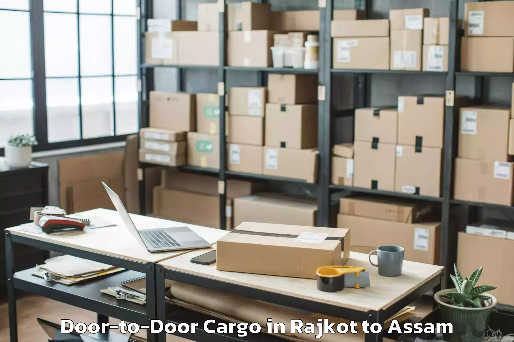 Reliable Rajkot to Udharbond Door To Door Cargo